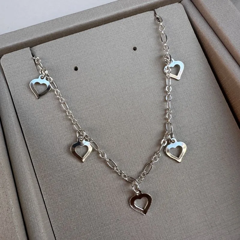 Pulseira coração vazado